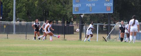 Female Soccer Players on Field Playing